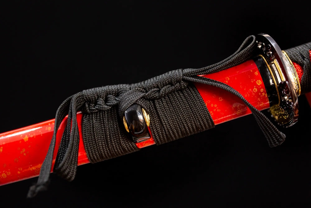Thick black‑red mixed‑braided sageo cord gilded‑alloy fitting macro close‑up