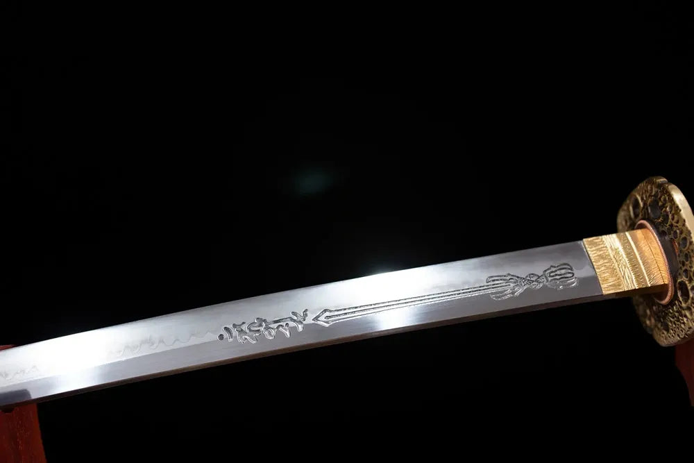 Upper T10 clay‑tempered katana blade brass habaki midare‑gunome meteor‑burst‑streaking flowing hamon temper‑line macro close‑up