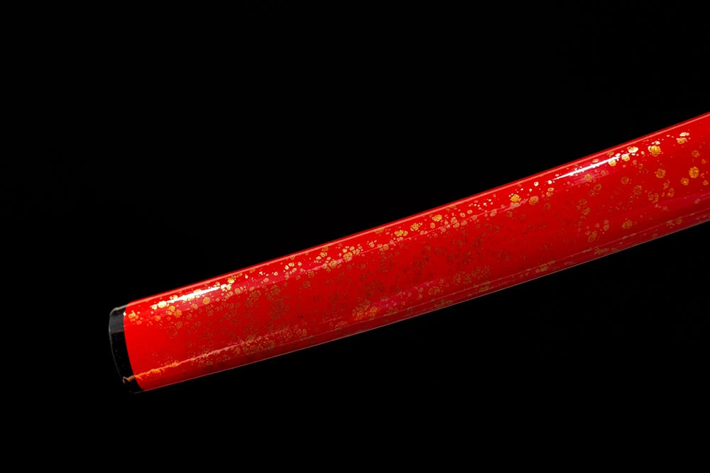 Bottom bright‑red saya gilded‑alloy kojiri end‑cap close‑up