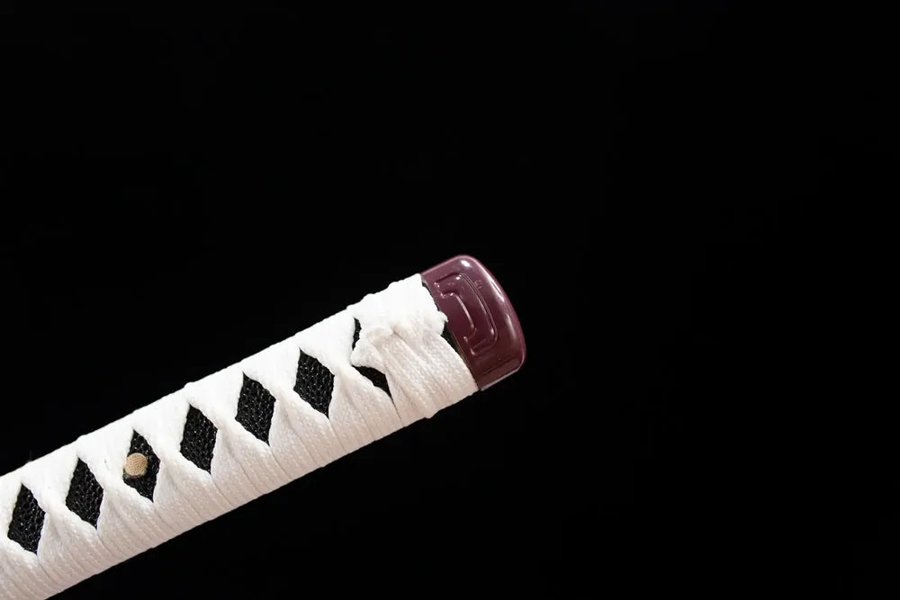 Top purple‑red alloy kashira pommel front close‑up