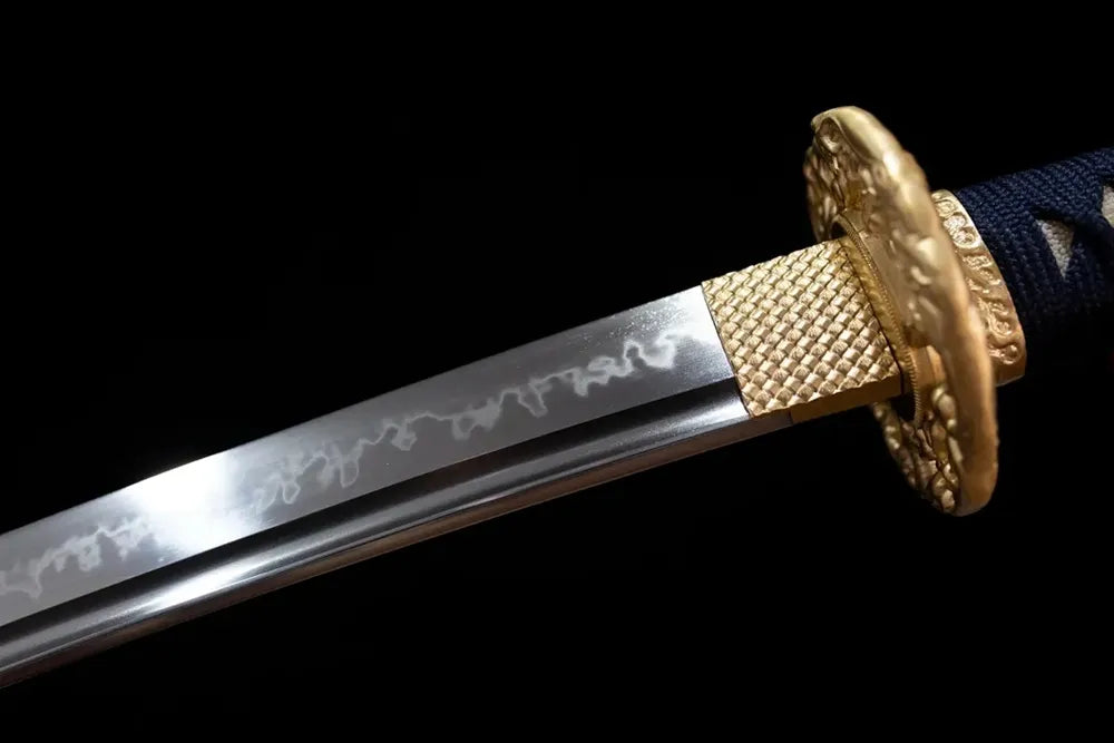 Upper T10 clay‑tempered wakizashi blade brass habaki splash‑pattern splashing‑surf‑ripple hamon temper‑line macro close‑up‑short wakizashi blade