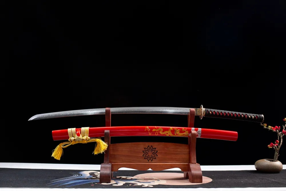 Flat lay fully drawn folded damascus ripple blade red dragon katana set