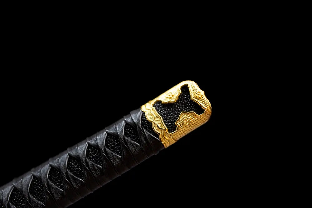 Top chrysanthemum‑mon gilded‑brass kashira pommel front close‑up