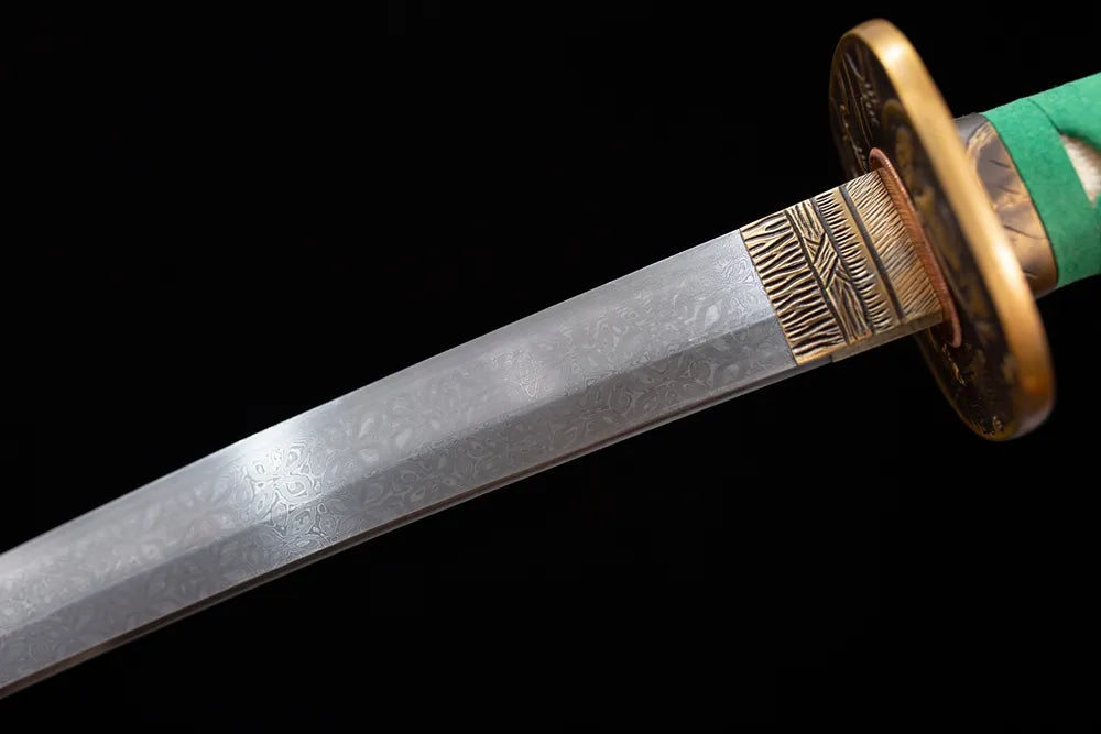 Upper folding‑forged damascus oil‑quenched katana blade brass habaki botanical‑etch garden‑scenery ornament surface macro close‑up