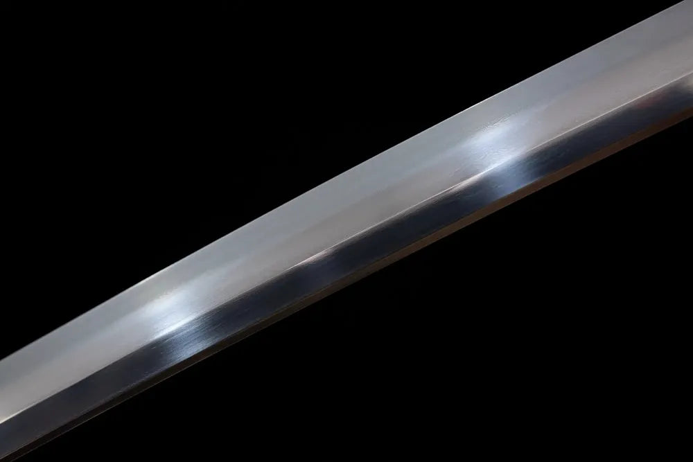 Mid‑section midare‑badamashi chaotic‑varied‑pattern hamon steel katana blade surface close‑up shot