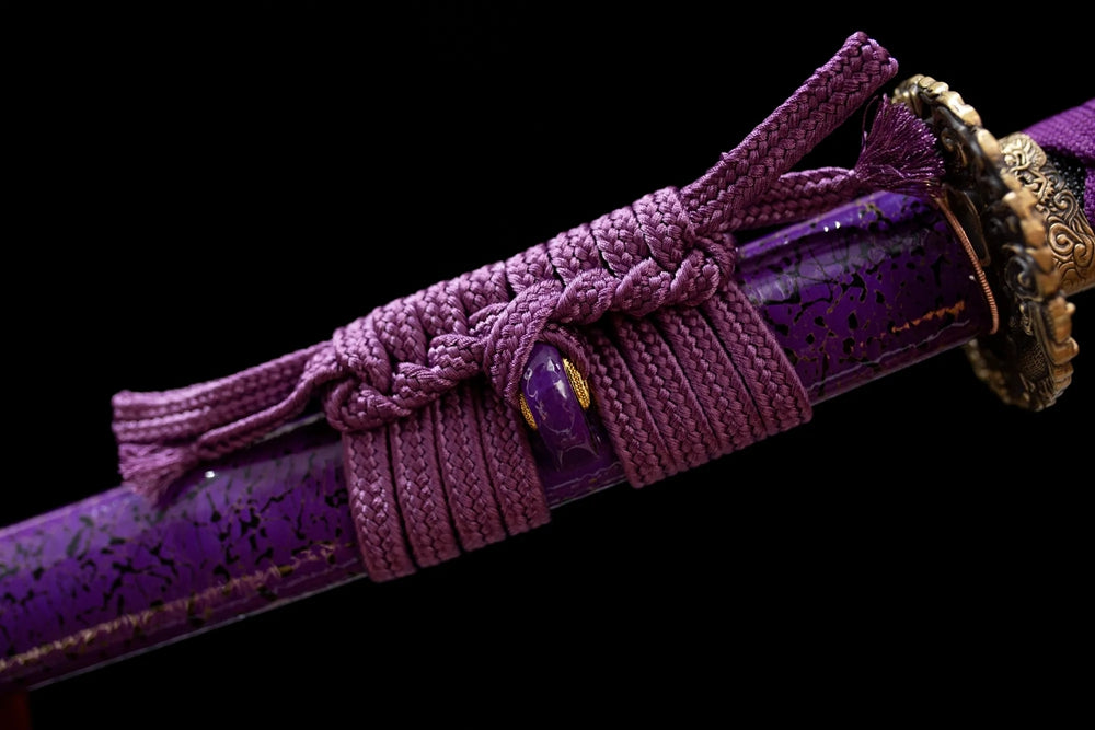 Thick lavender‑mauve mixed‑braided sageo cord purple‑toned purple‑gild fitting macro close‑up