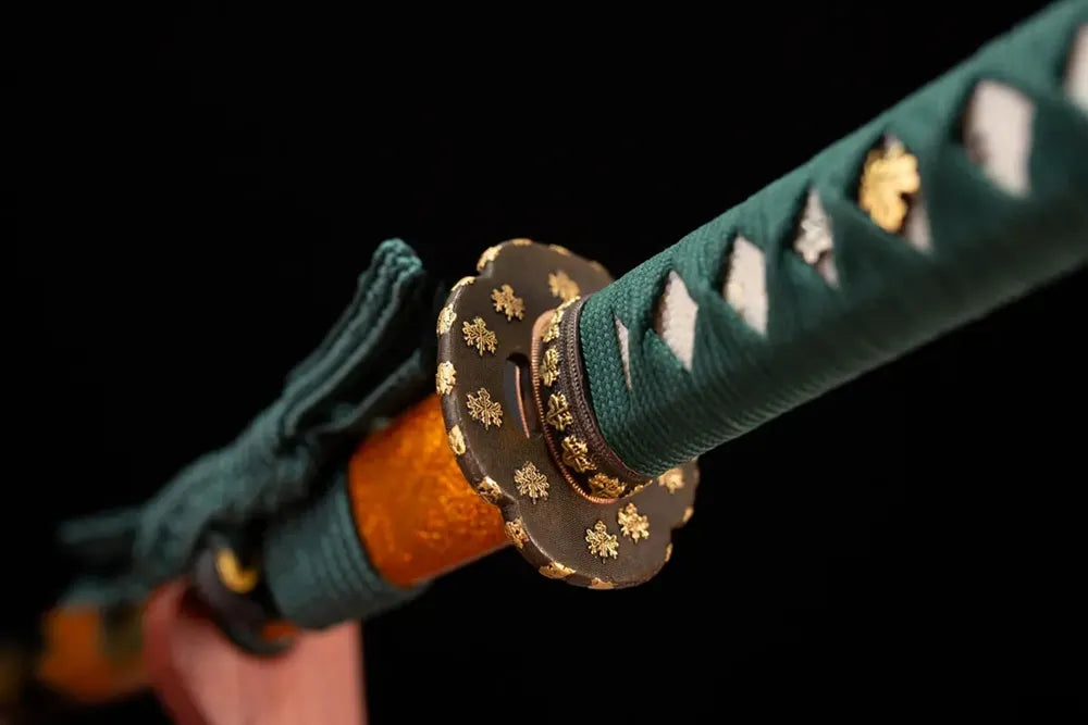 Reverse‑side autumn‑maple‑scroll carving gilded‑bronze tsuba surface texture close‑up