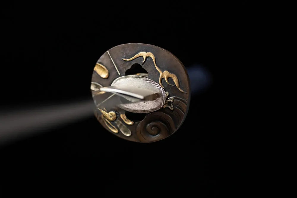 Front open‑work thunder‑cloud‑relief dark‑silver aged‑alloy katana hand‑guard close‑up