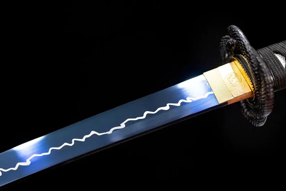 Upper T10 clay‑tempered katana blade brass habaki choji‑midare mottled‑color‑wave shifting hamon temper‑line macro close‑up
