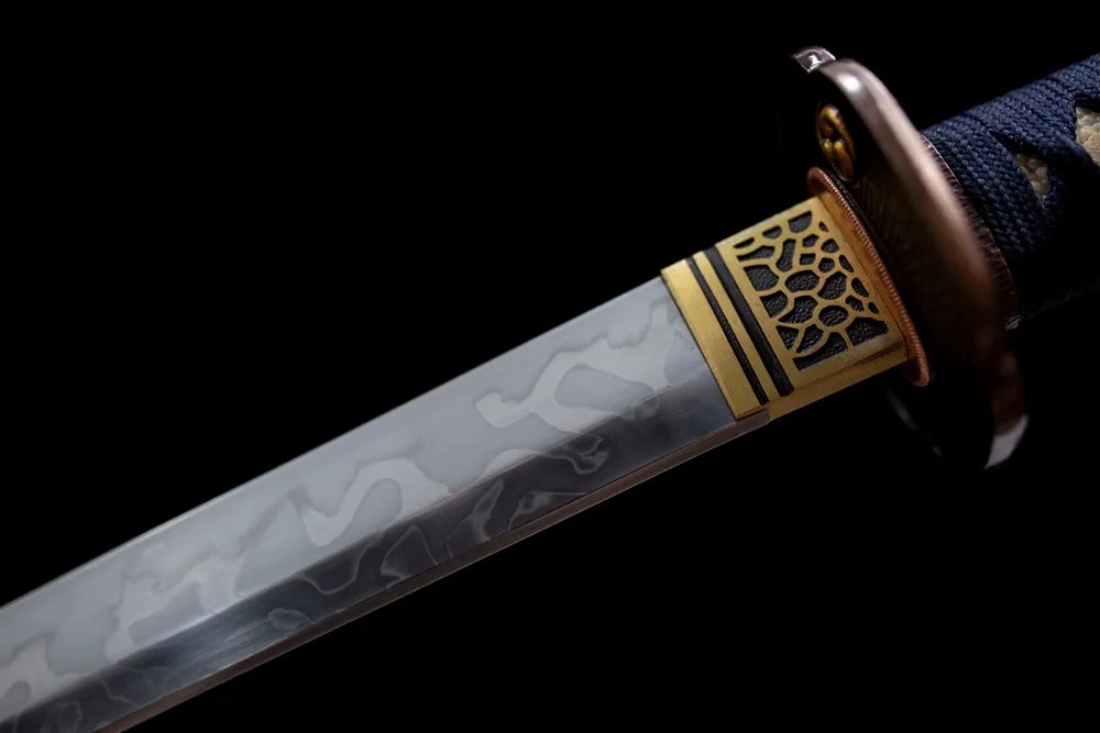Upper T10 clay‑tempered steel blade brass habaki cosmic‑nebula etching macro close‑up