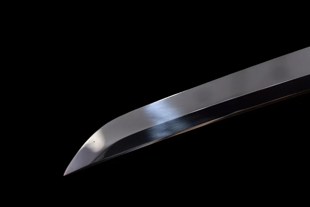 Compact functional wakizashi‑style kissaki tip of Wing‑Wakizashi blade close‑up view
