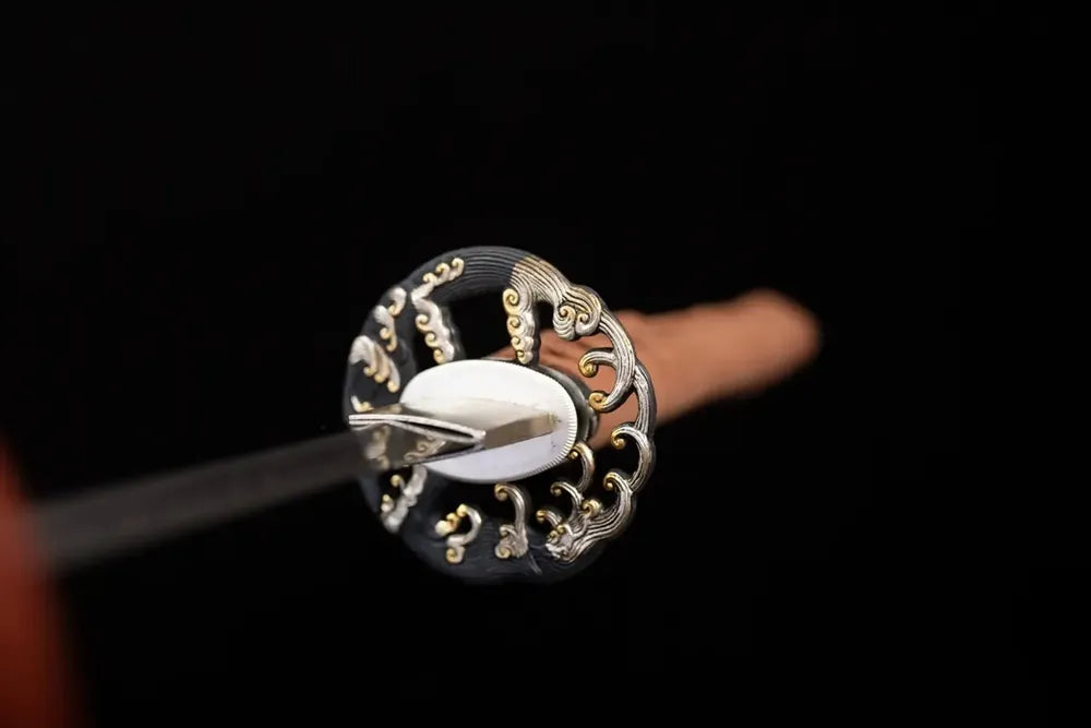 Front open‑work ocean‑tide‑surge‑scroll‑relief aged‑copper katana hand‑guard close‑up