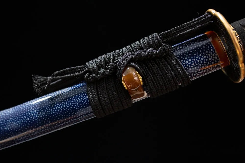 Thick ice‑blue mixed‑braided sageo cord ice‑blue silver‑gild fitting macro close‑up