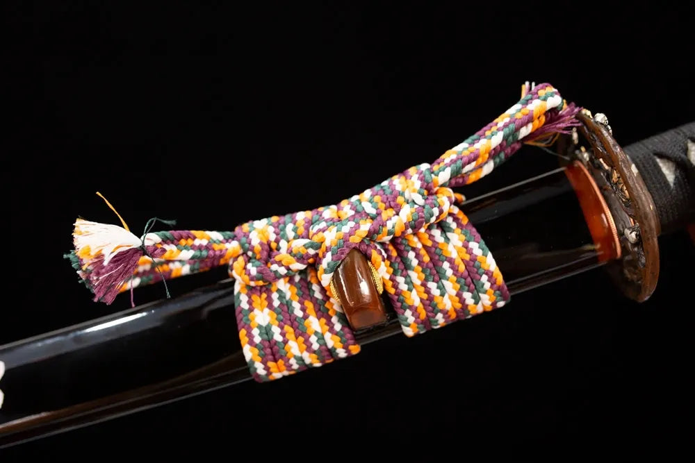 Thick multi‑color mixed‑braided sageo cord two‑tone aged‑copper fitting macro close‑up