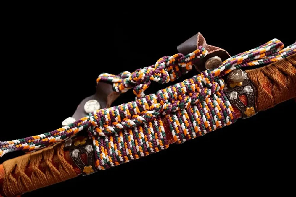 Multi‑color mixed woven tachi‑no sageo cord copper alloy fitting macro close‑up