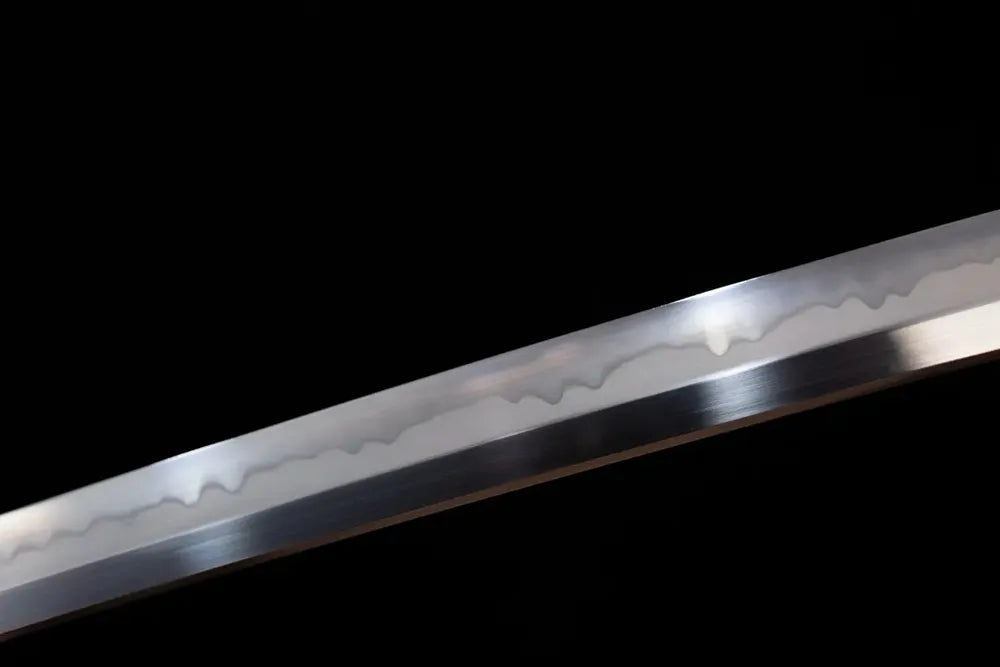 Mid‑section sanbonsugi three‑cedar‑tree‑pattern flowing‑undulating hamon steel katana blade surface close‑up shot