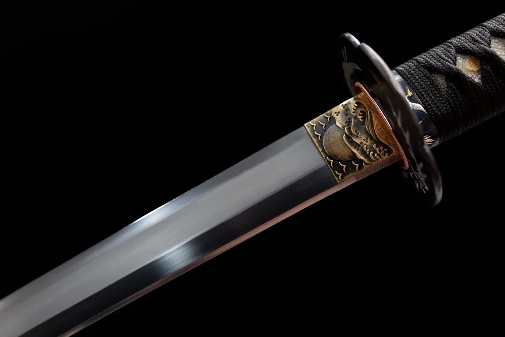Upper choji hamon blade + bronze crane habaki close shot
