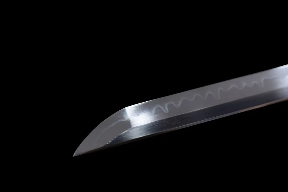 Classic katana‑style functional kissaki tip of Black‑Widow‑Katana blade close‑up view