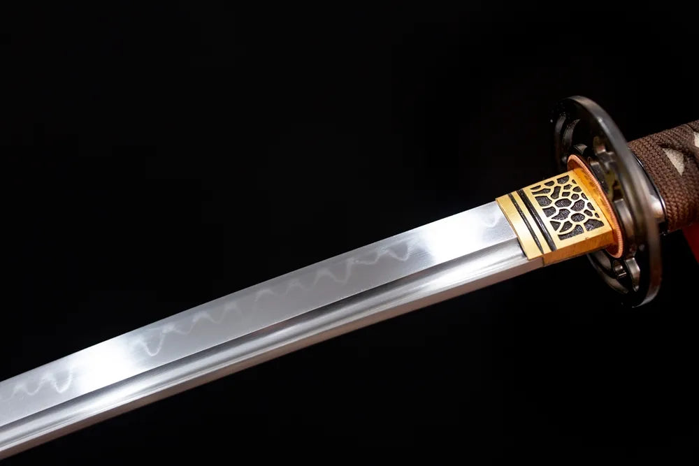 Upper T10 clay‑tempered katana blade brass habaki sanbonsugi robust three‑cedar‑tree hamon temper‑line macro close‑up
