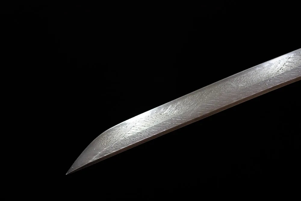Classic functional katana‑style kissaki tip of Katana‑Bird blade close‑up view