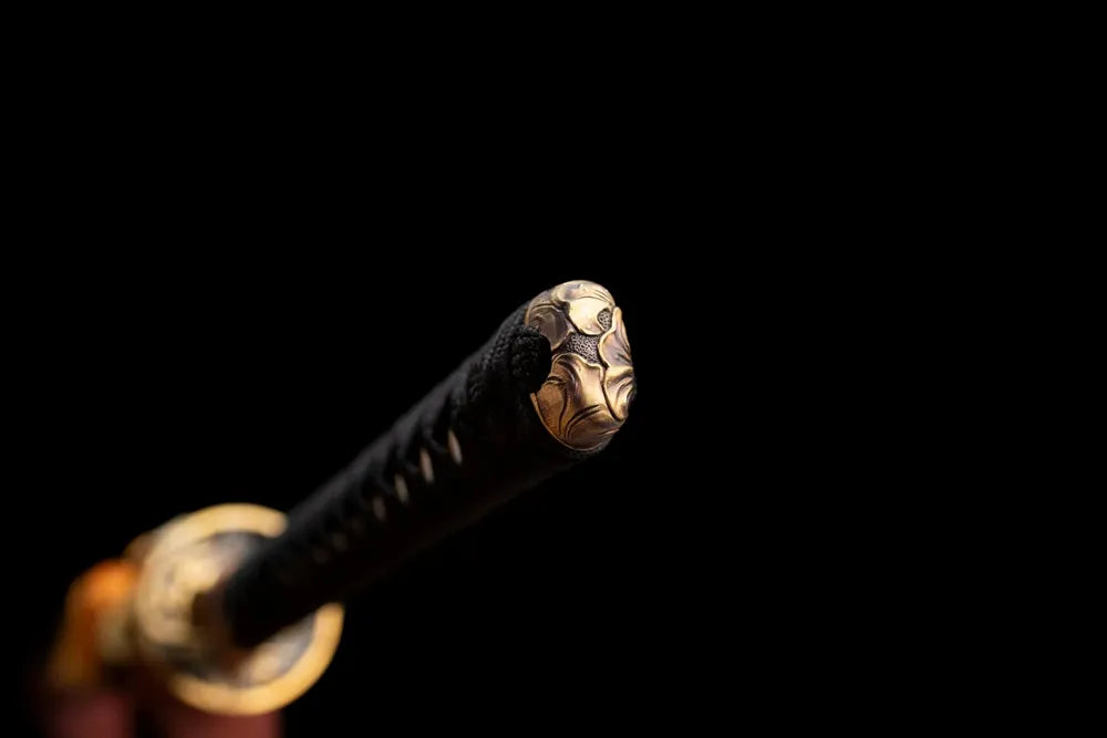 Sakura‑blossom carved brass‑alloy pommel‑cap detail shot