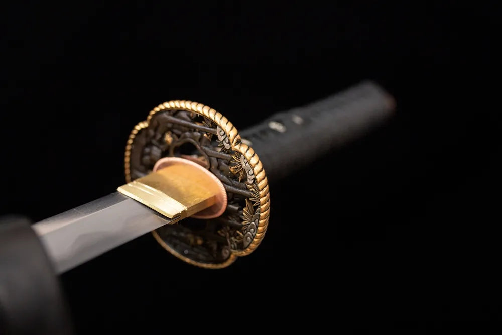 Front open‑work samurai‑minimal‑relief copper‑gilded‑silver wakizashi hand‑guard close‑up