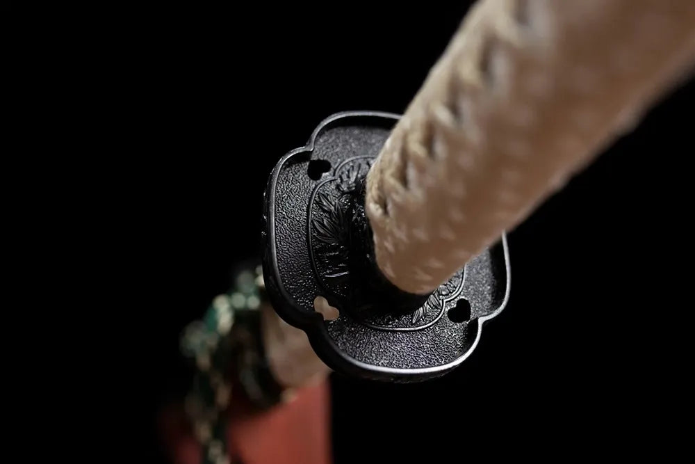 Reverse‑side sakura‑river‑scenery carving zinc‑alloy tsuba surface texture close‑up
