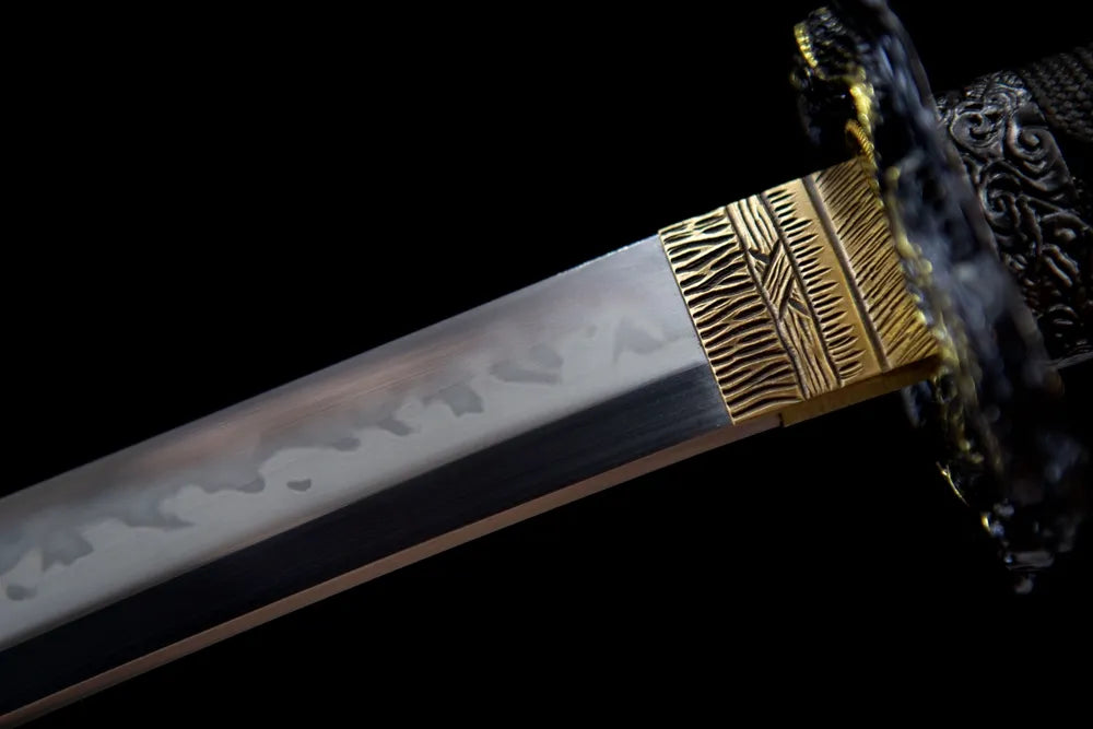 Upper choji wave hamon blade & gold habaki close-up