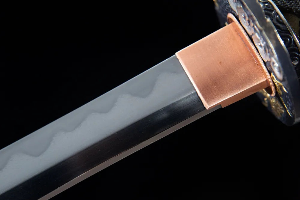 Upper blade closeup neat continuous gunome wave hamon near gilded copper habaki