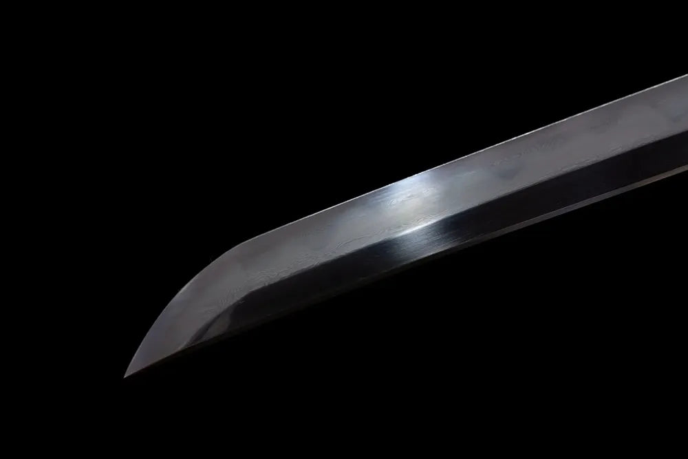 Extended elegant tachi‑style kissaki tip of Mansion‑Tachi blade close‑up view