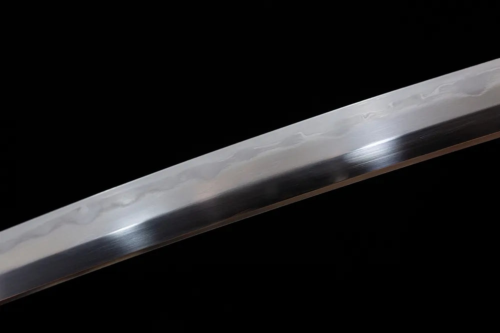 Mid‑section gonome‑midare classical wave‑pattern hamon composite‑steel tachi blade surface close‑up shot