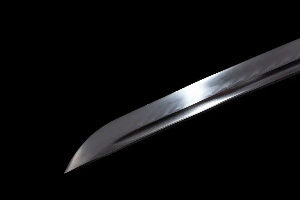 Classic smooth ornamental‑style kissaki ginkgo katana blade tip close view