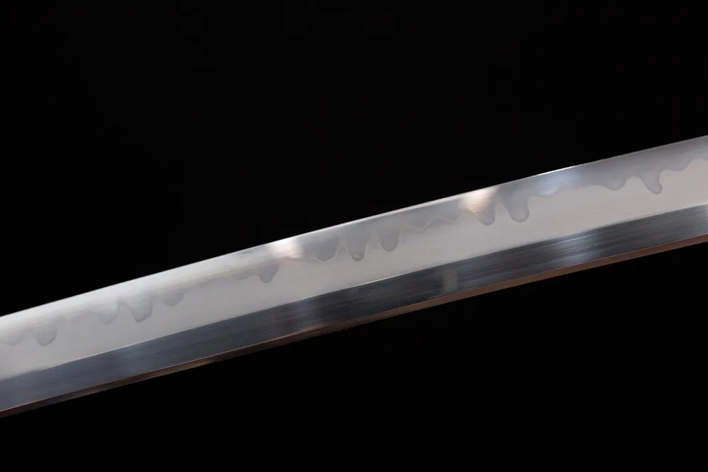Mid‑section sanbonsugi three‑cedar‑tree‑pattern hamon steel katana blade surface close‑up shot