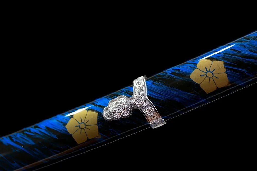 Bottom deep‑blue saya silver‑toned alloy kojiri end‑cap close‑up