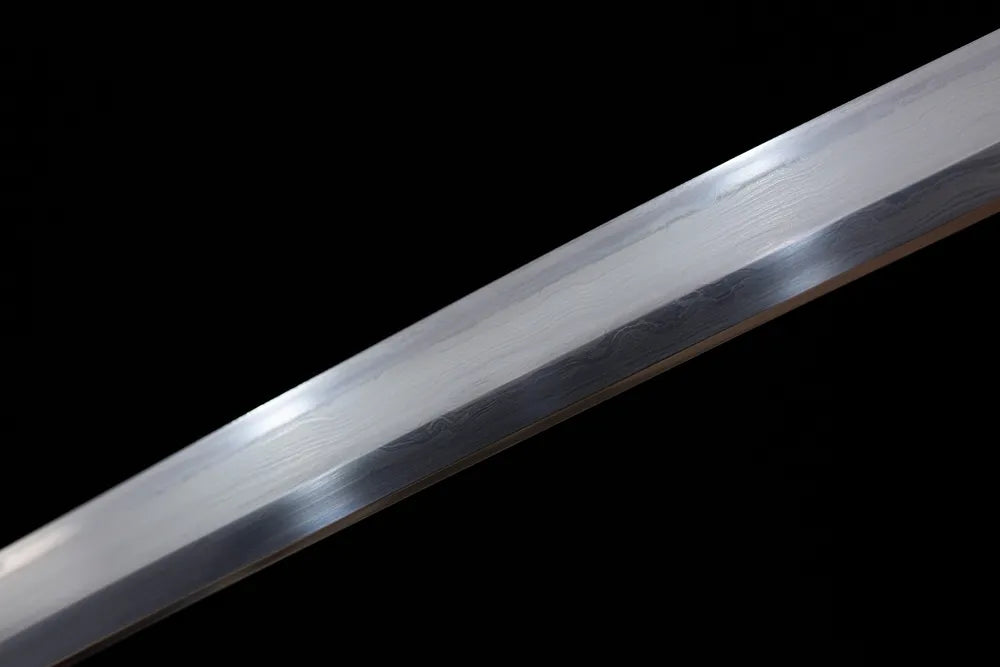 Mid‑section clean suguha straight‑line hamon sanmai composite‑forged katana blade surface close‑up shot