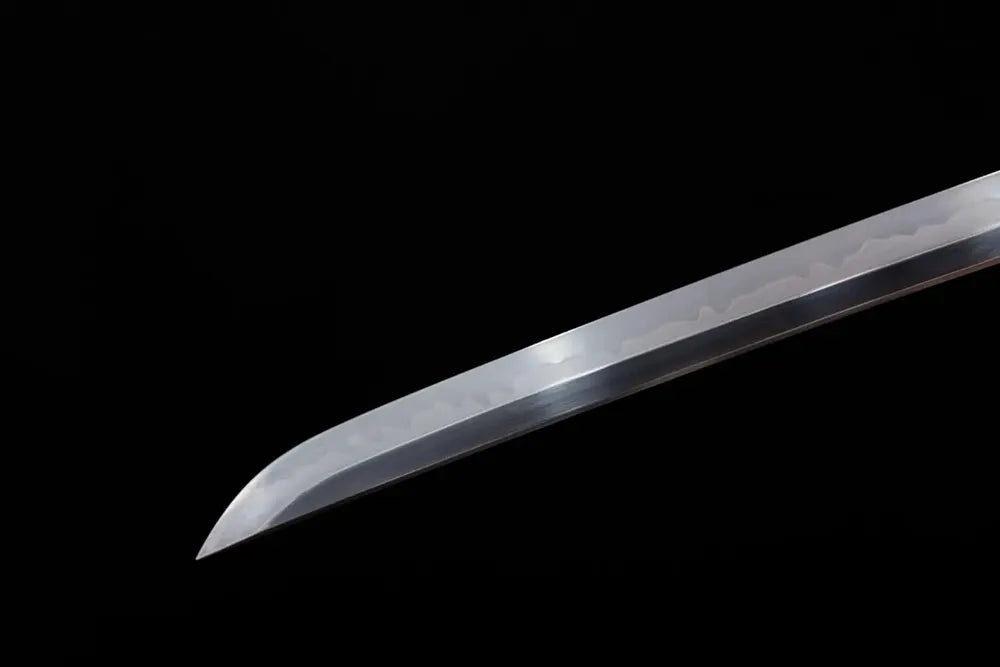 Classic functional katana‑style kissaki tip of Wave‑Current‑Katana blade close‑up view