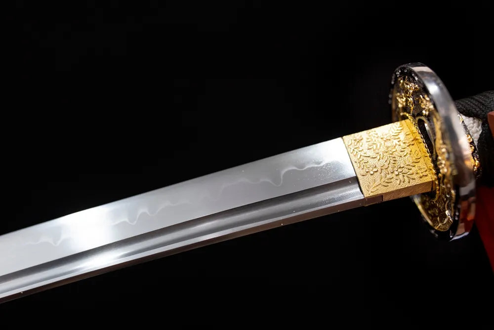 Upper T10 clay‑tempered katana blade brass habaki gunome undulating‑wave hamon temper‑line macro close‑up‑long katana