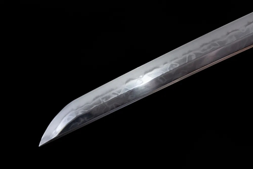 Sharp classic kissaki damascus blade tip close view