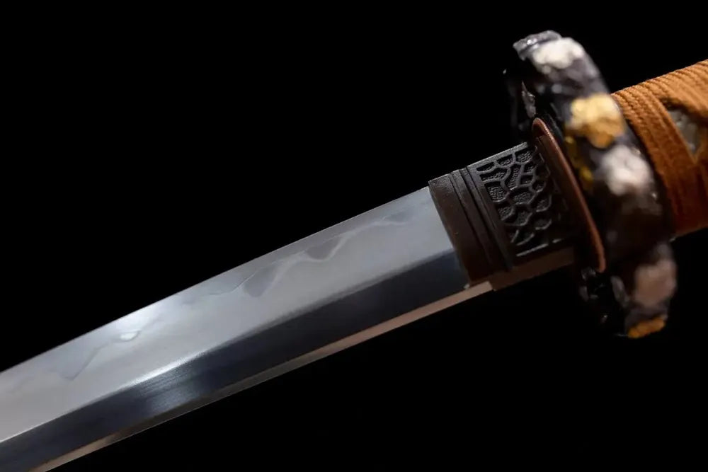 Upper sanmai‑gitae composite forged blade copper habaki gunome hamon wave line macro close‑up