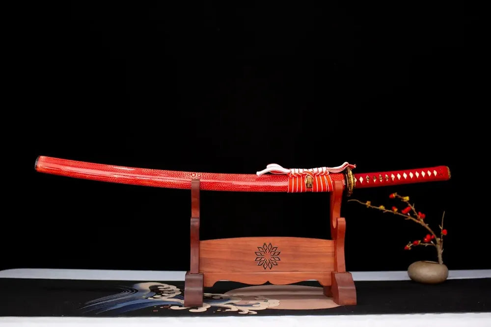 Horizontal laid closed scarlet‑red white‑dot ray‑skin‑texture Purgatory‑Katana scabbard flat table‑top front display