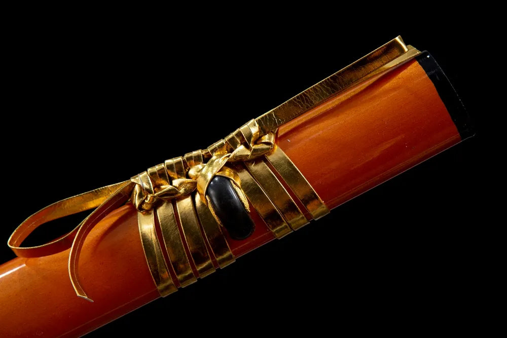 Golden metal wrapped sage cord tied on orange lacquer saya ring