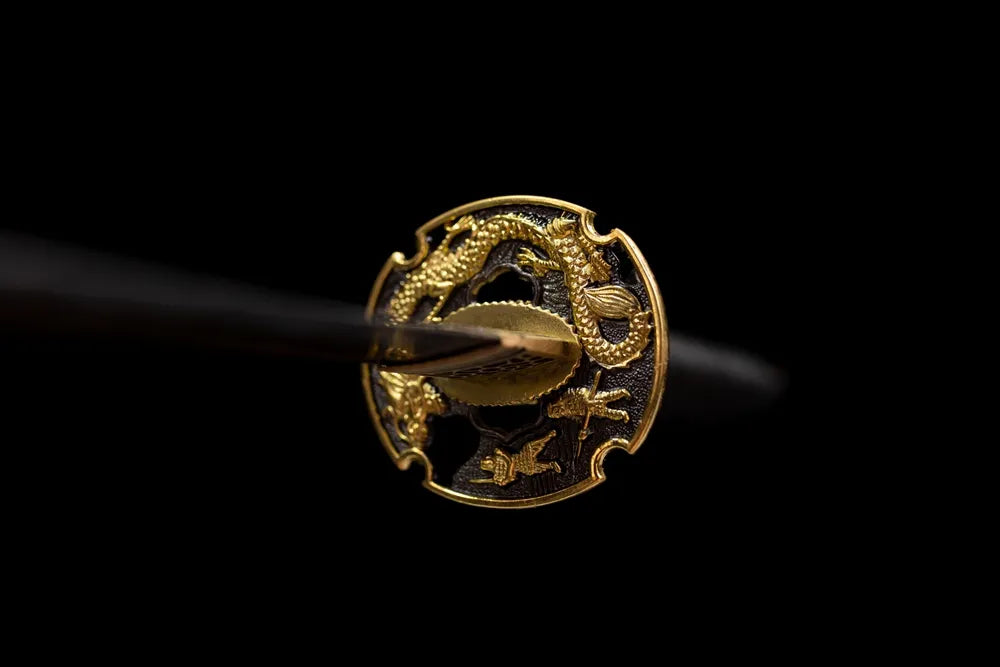 Front open‑work 3D gilded dragon‑warrior‑relief alloy tachi hand‑guard close‑up