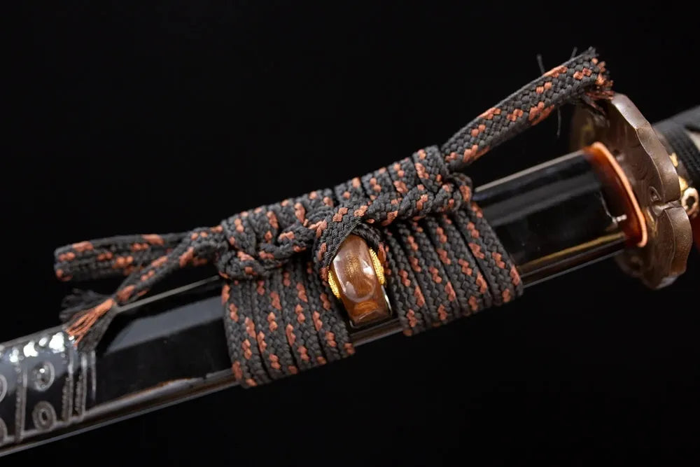 Thick deep‑golden heavy‑braided sageo cord antique‑gilt bronze fitting macro close‑up