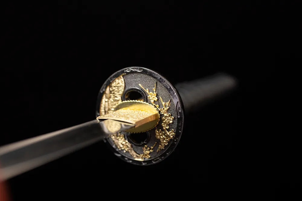 Front open‑work plum‑blossom‑scroll‑relief gilded‑alloy katana hand‑guard close‑up‑long katana