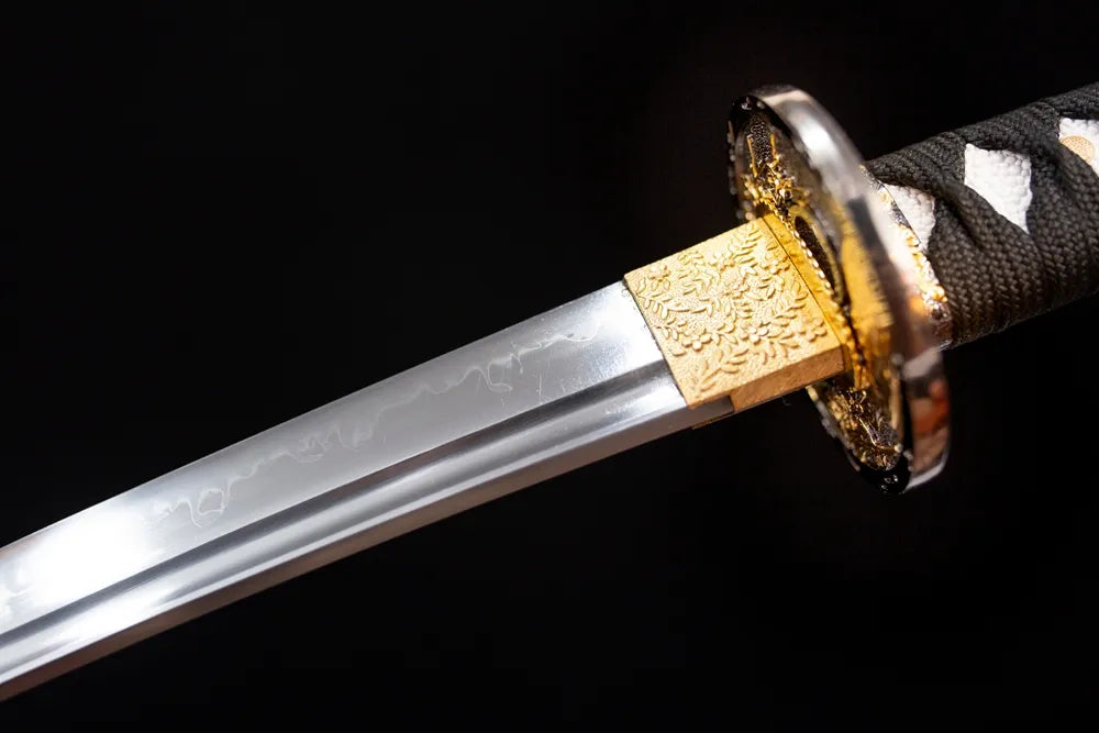 Upper T10 clay‑tempered wakizashi blade brass habaki gunome undulating‑wave hamon temper‑line macro close‑up‑short wakizashi