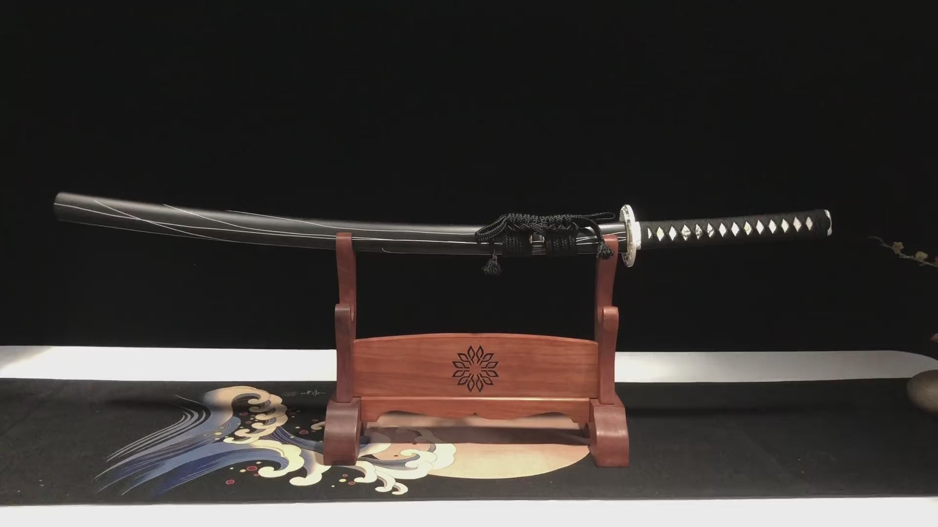 This katana(samurai sword) is forged from Damascus steel. The surface is oxidized and blackened