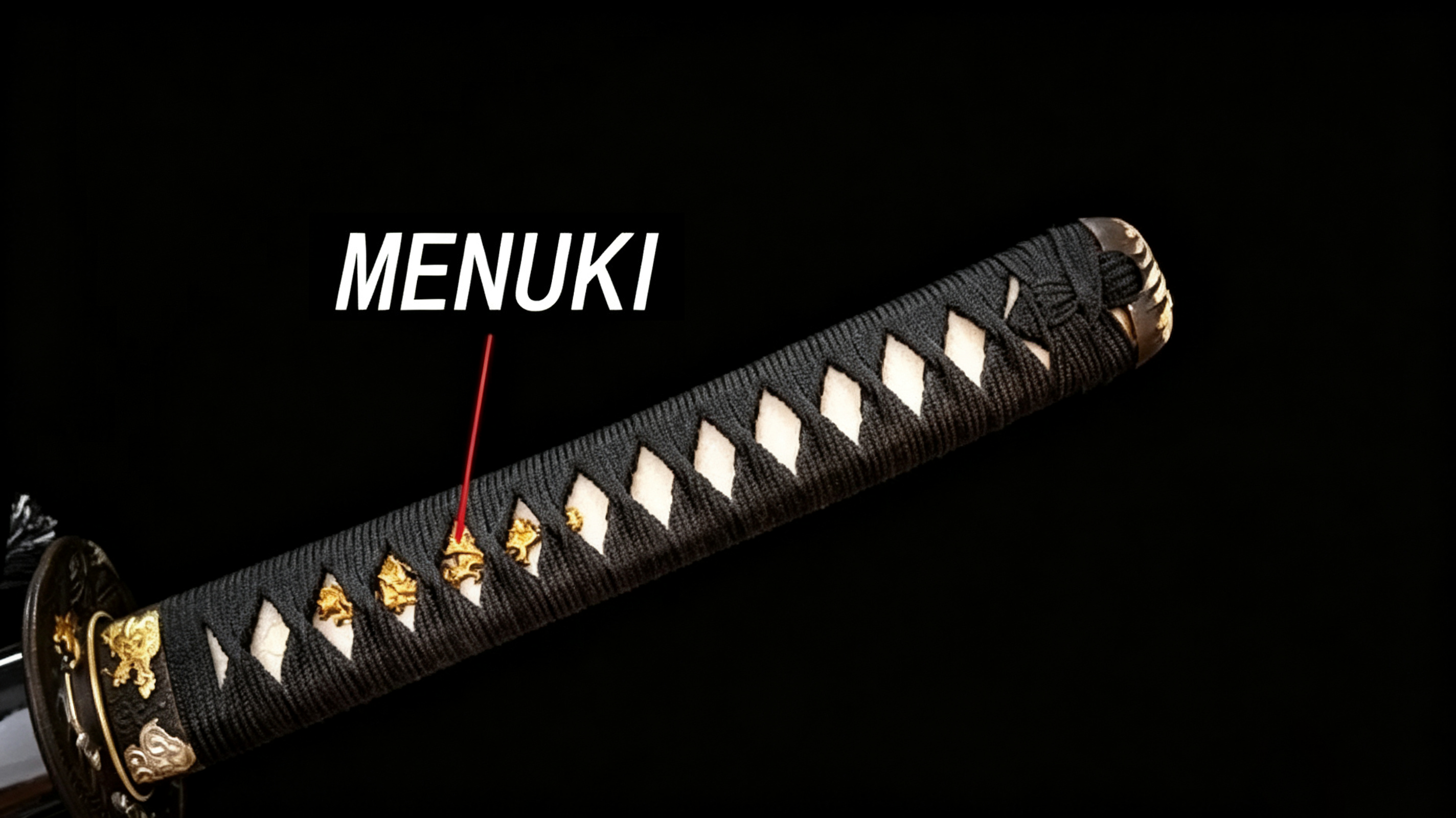 Dark‑background studio close‑up of katana tsuka handle, white annotation arrow pointing to golden menuki ornaments exposed through tsuka‑ito diamond gaps