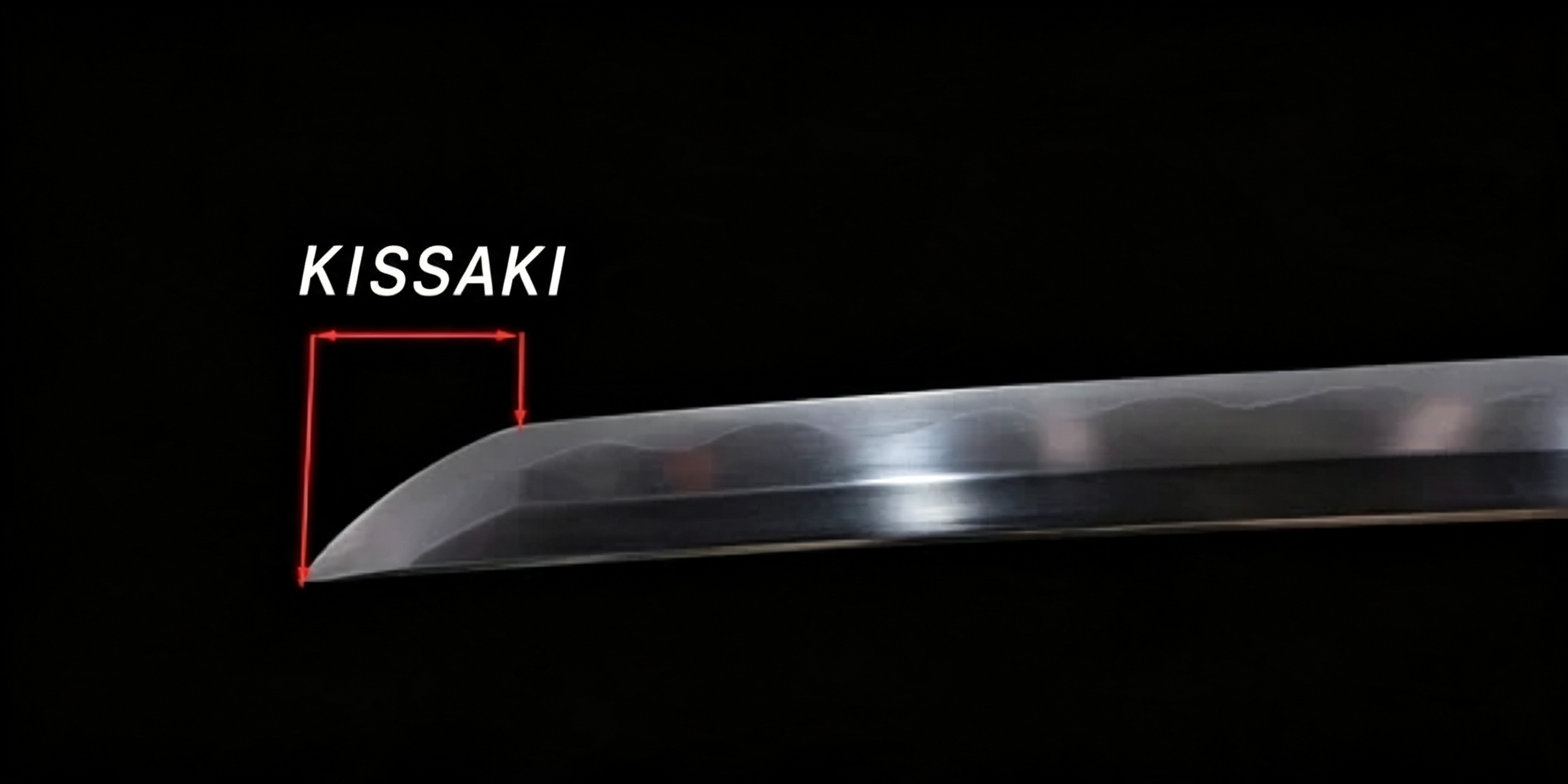 Close-up studio shot of polished katana kissaki blade tip against solid pure black background, nihonto detail photograph
