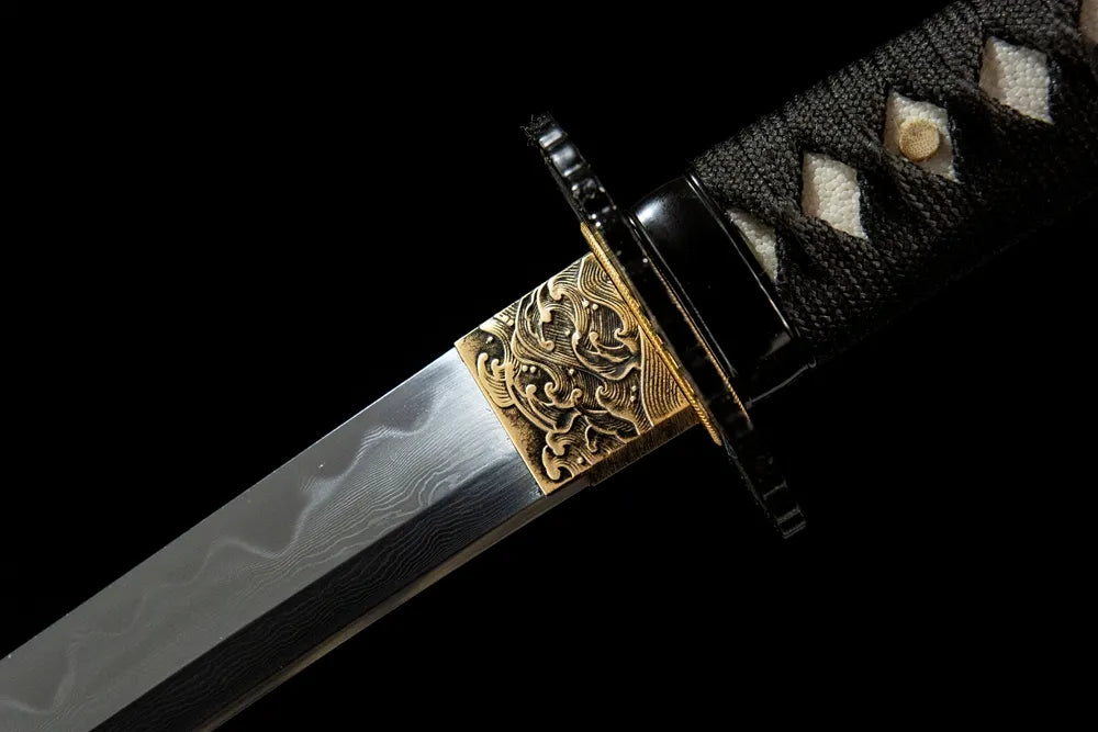Black Edge Katana upper blade detail near iron tsuba, Folding steel texture