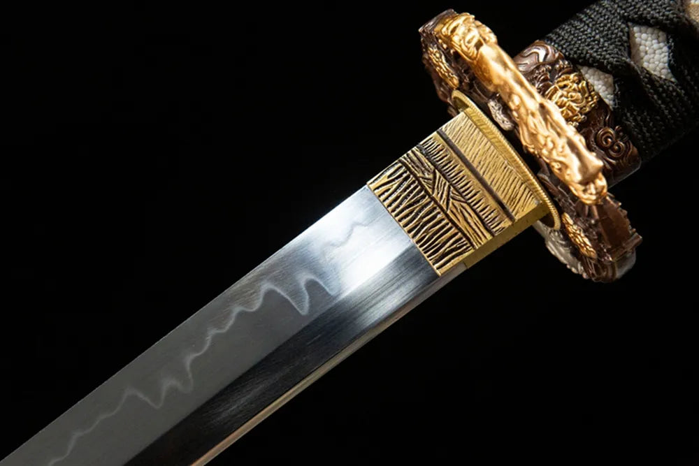Lion King Tachi upper blade detail near tsuba, T10 steel texture